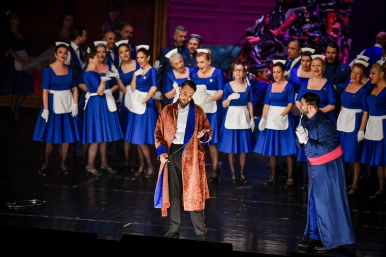 Luka Jozic before the chorus in a patterned robe