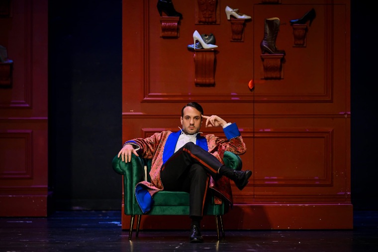 Luka Jozic seated in a green armchair in a patterned robe