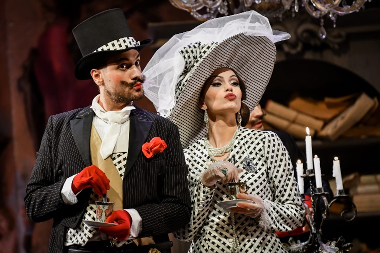 Luka Jozic in top hat beside a costumed lady